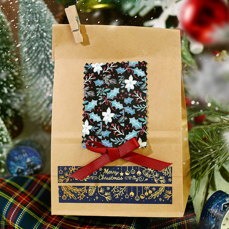 Brown paper bag with Christmas design featuring a bow and &