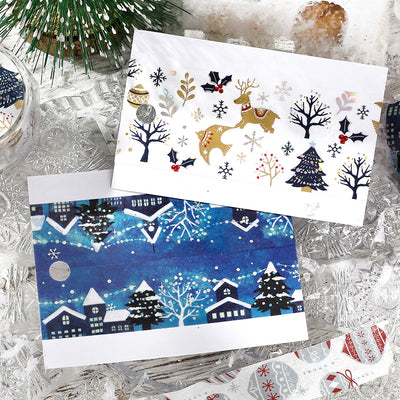 Two Christmas-themed cards on a textured surface with decorative elements.