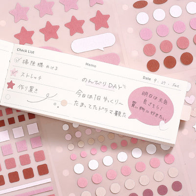 Check list and memo paper on a pink background with decorative stickers