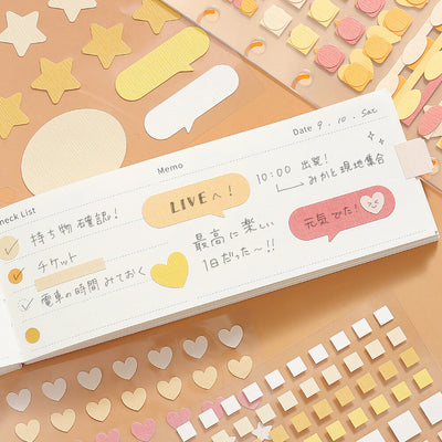 Notebook with decorative stickers on a colorful background