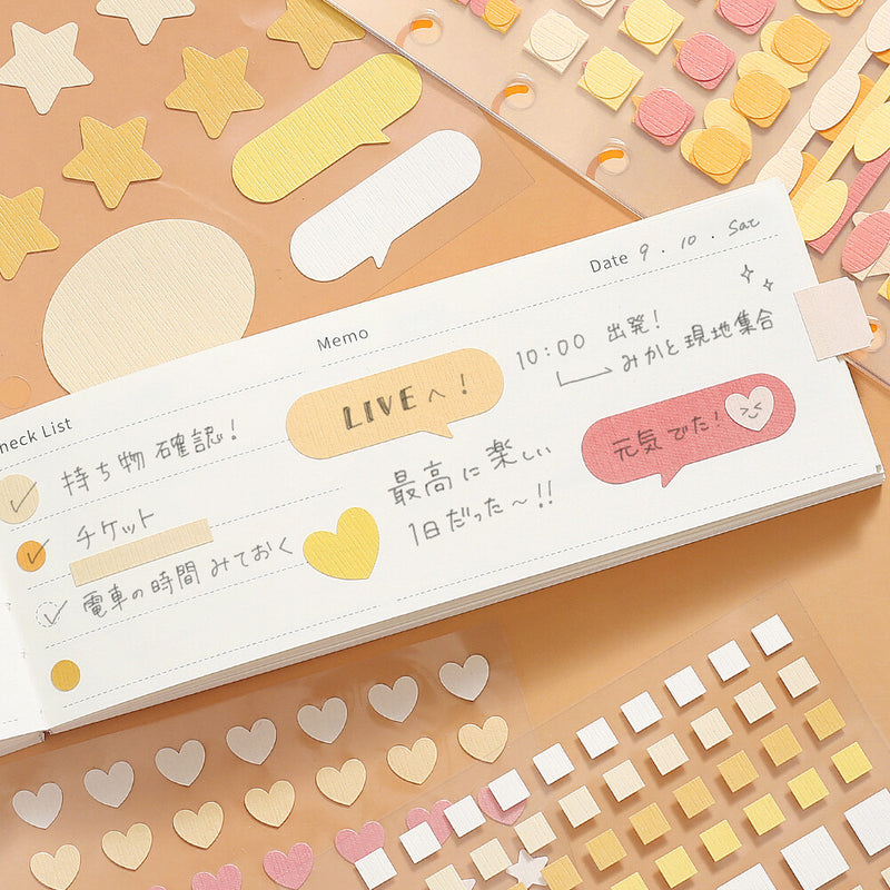 Notebook with decorative stickers on a colorful background