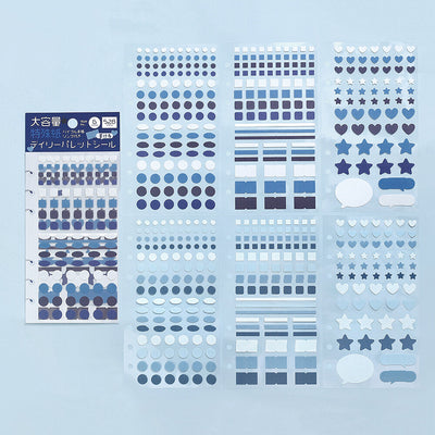 Collection of blue decorative stickers on a light blue background