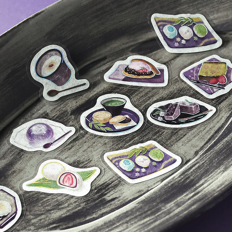 Stickers of Japanese sweets on a textured surface