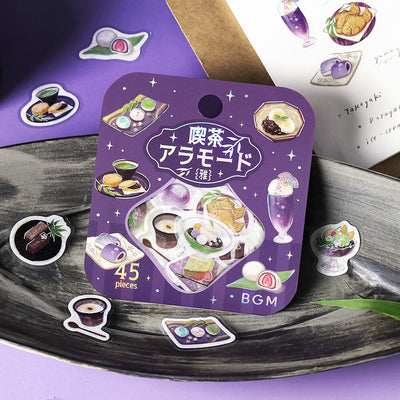 Purple packaging with illustrations of food items on a wooden surface