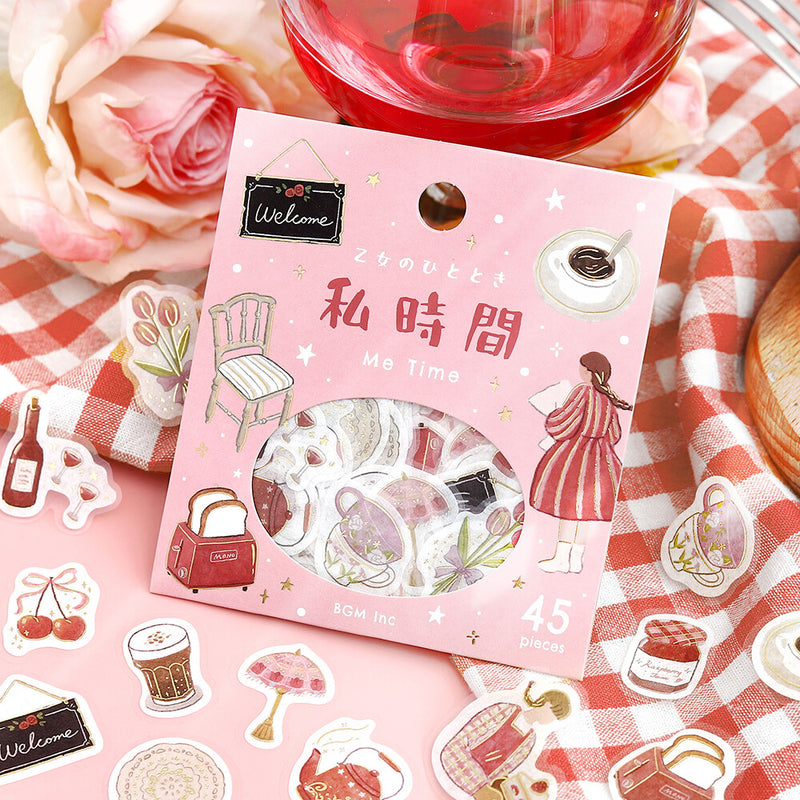 Sticker pack with cute illustrations on a checkered tablecloth with flowers and a glass of red liquid.