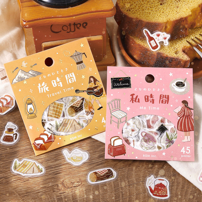 Two packages of stickers with illustrations on a wooden surface.