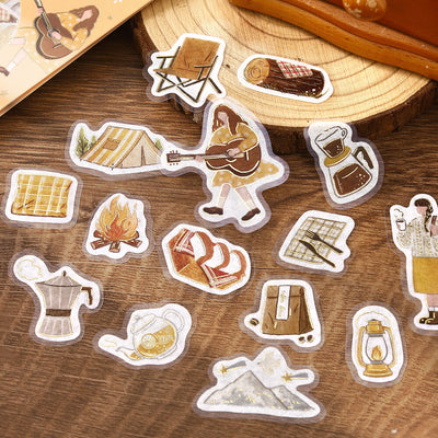 Set of illustrated stickers on a wooden surface