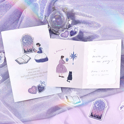 Open card with illustrations and text on a purple fabric background