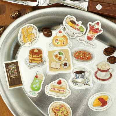 Sticker set of food items on a metallic surface