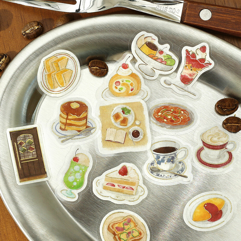 Sticker set of food items on a metallic surface