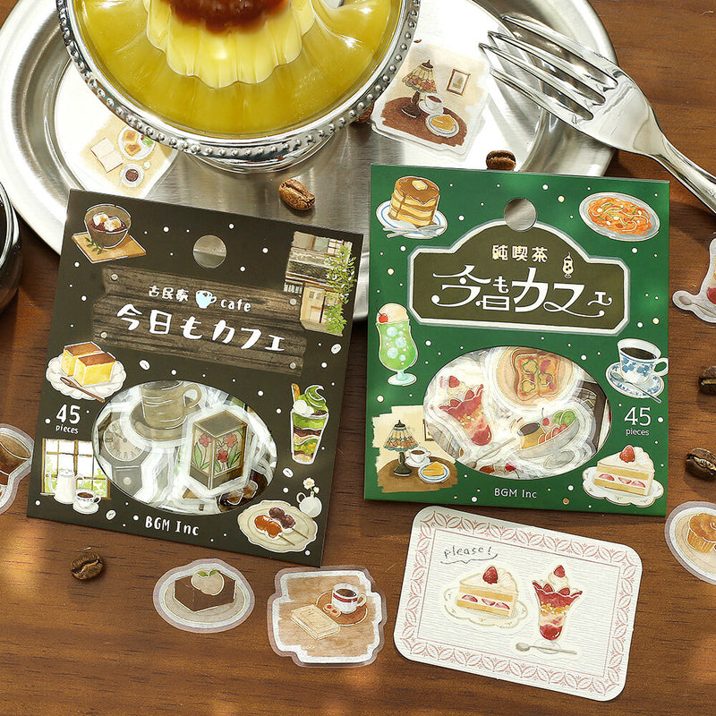 Sticker packs with food illustrations on a wooden surface with a dessert and fork.