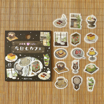 Set of illustrated stickers featuring cafe-themed designs on a bamboo mat background