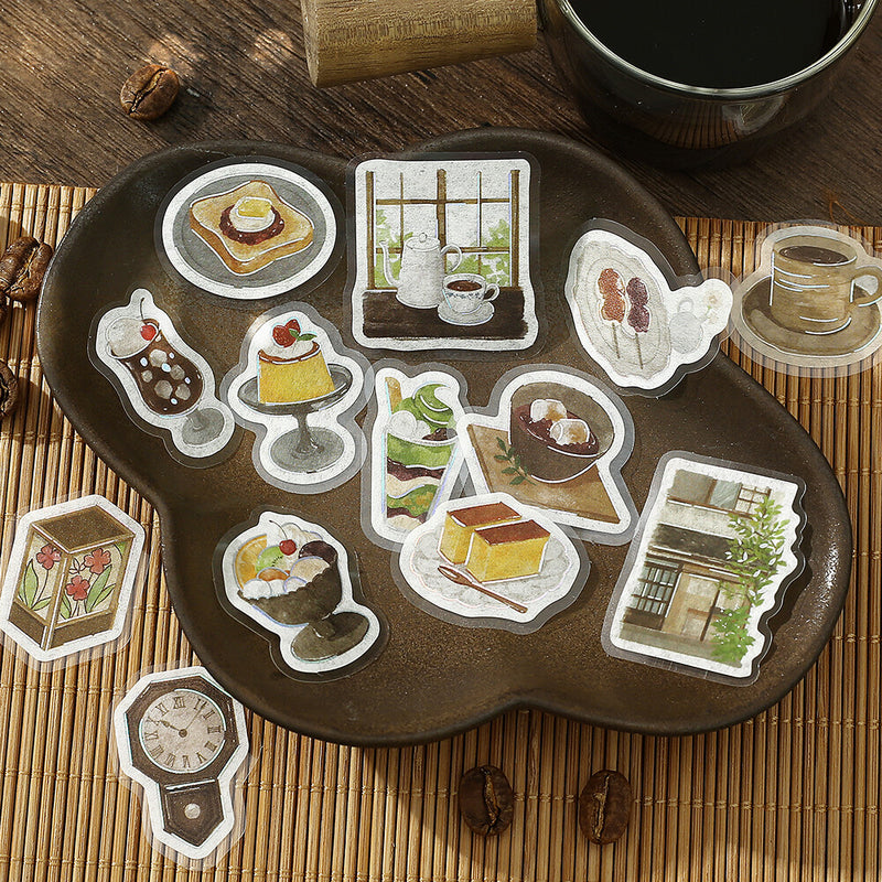 Set of illustrated stickers on a wooden tray with coffee and coffee beans.