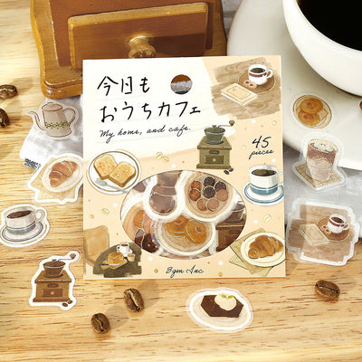 Packaging of 'My home, and cafe' sticker set with illustrations of coffee and pastries on a wooden surface.