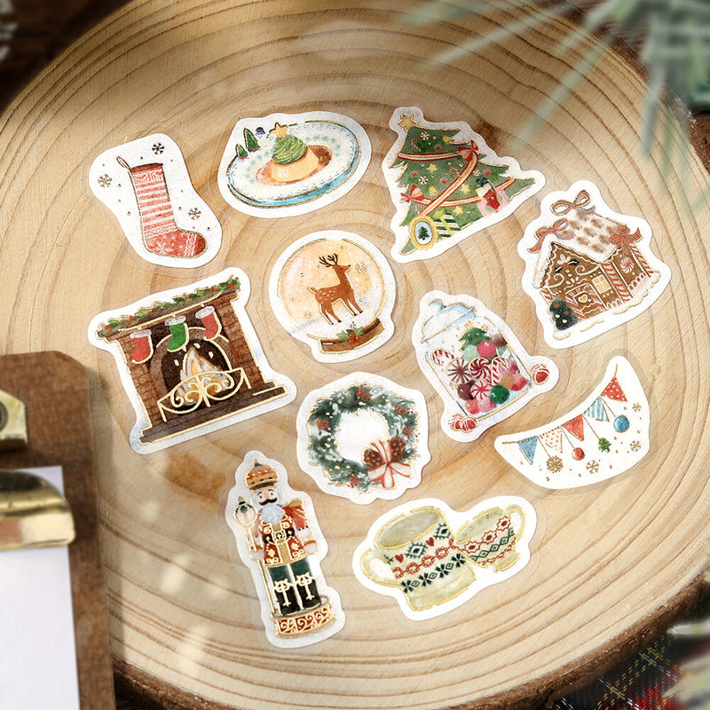 Set of Christmas-themed stickers on a wooden surface
