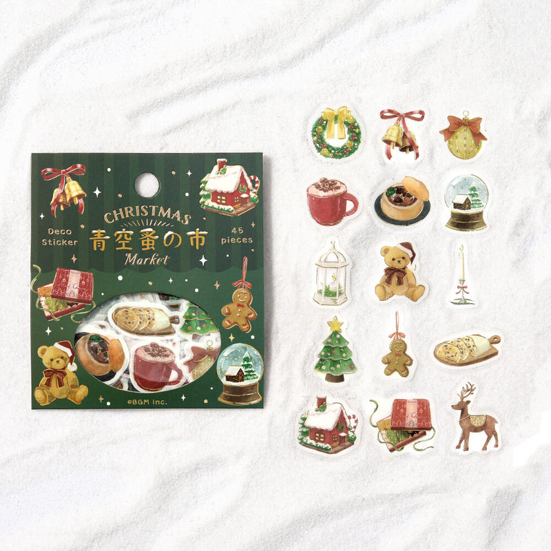 Christmas-themed sticker set with packaging on a white background
