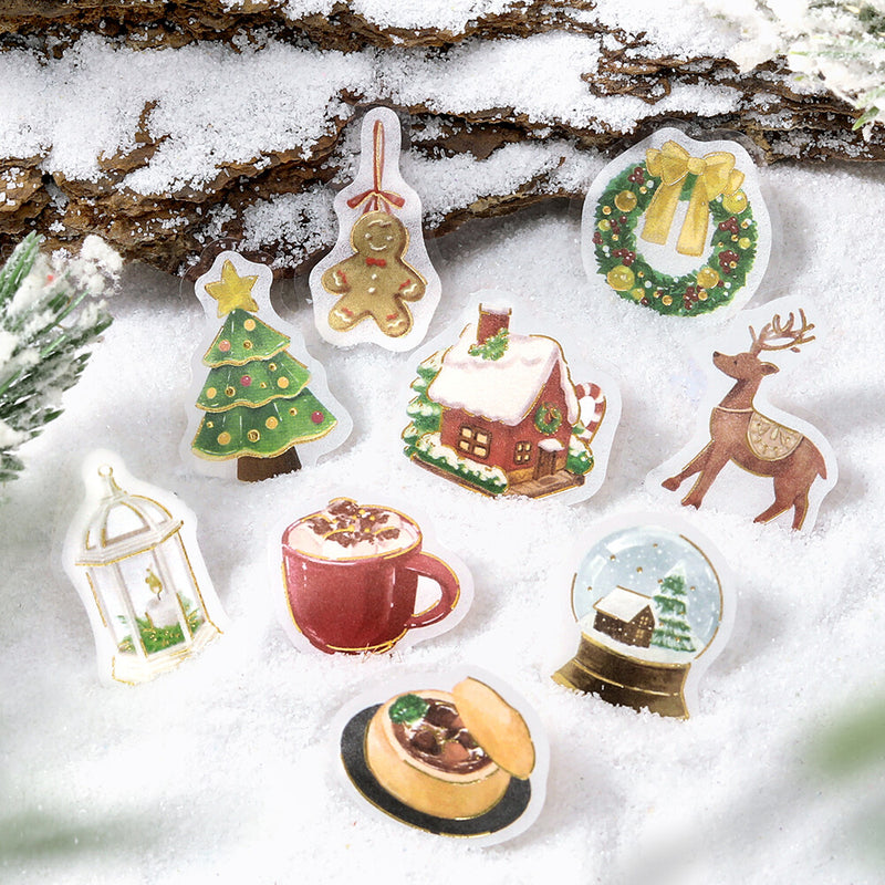 Set of Christmas-themed stickers on a snowy background