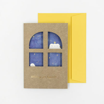 Greeting card with starry night design and yellow envelope on a white background
