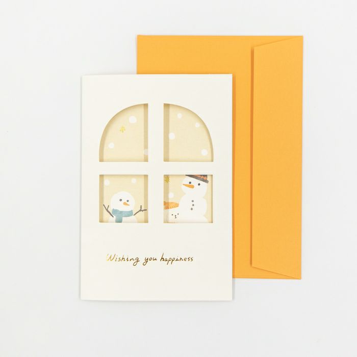 Greeting card with snowman design and orange envelope on a white background