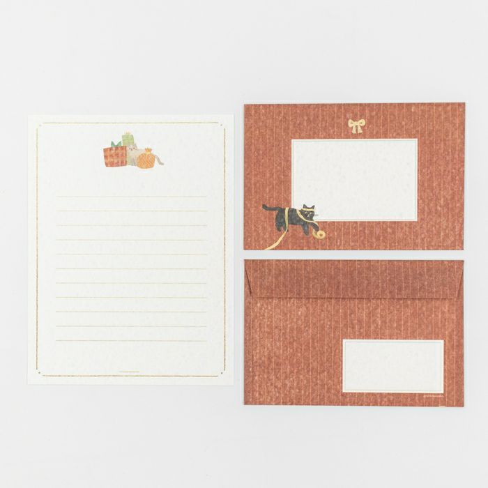 Set of stationery items with a cat illustration on a white background