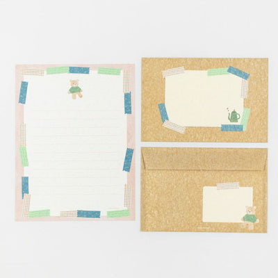 Set of stationery items with a bear design on a white background
