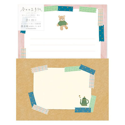 Stationery set with a bear design on a white background