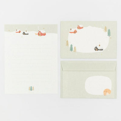 Set of stationery items with a bear and nature-themed design on a white background