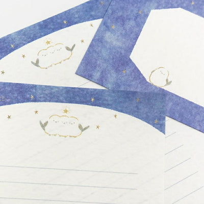 Decorative paper with blue and white design on a white surface