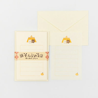 Set of stationery items with a character design on a light gray background