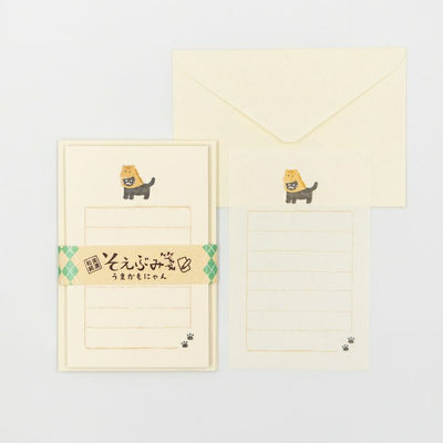 Stationery set with a cute cat design on a light gray background