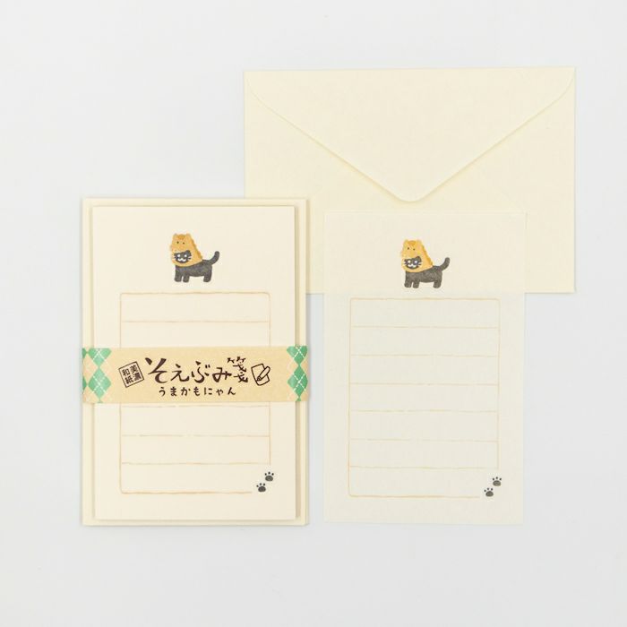 Stationery set with a cute cat design on a light gray background