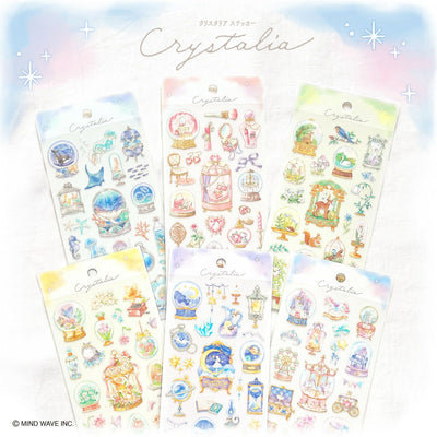 Set of 'Crystalia' themed stickers with pastel colors on a soft blue background.