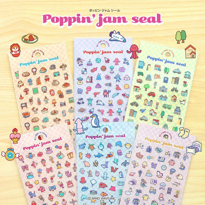 Set of colorful 'Poppin' jam seal' sticker sheets on a wooden surface