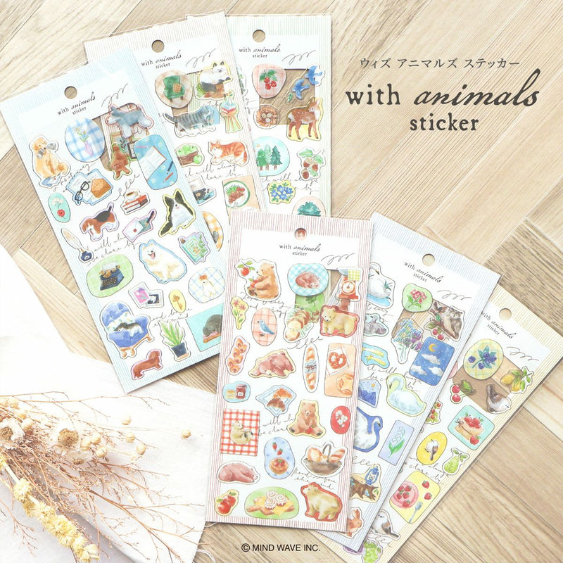 Sheets of animal-themed stickers on a wooden surface with &