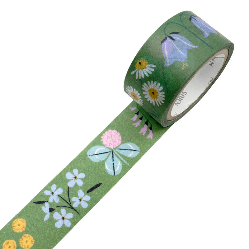 Roll of decorative tape with floral design on a green background