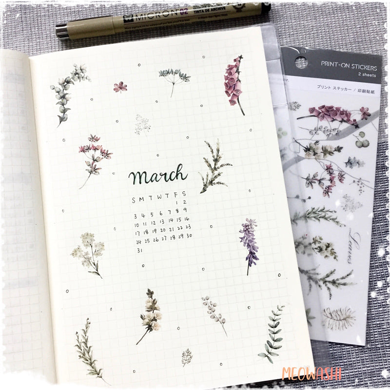 Bullet journal March cover decorated with MU print on sticker